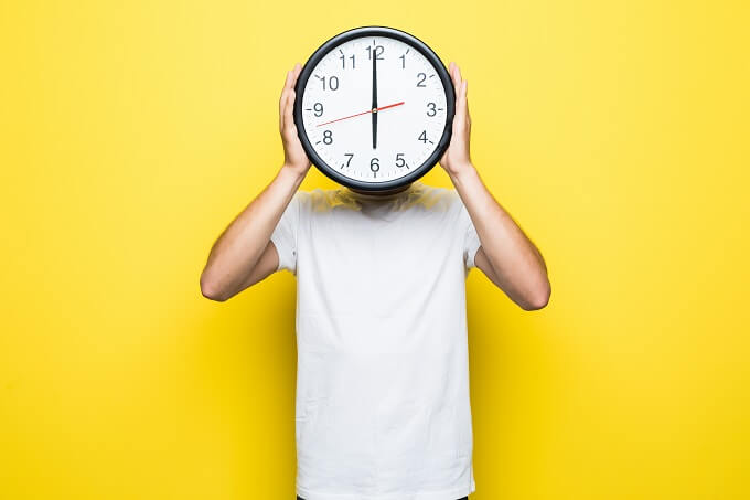 Man holding a clock