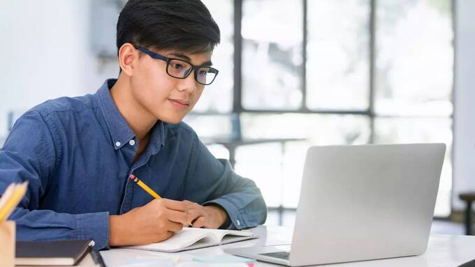 Boy writes key points of training session